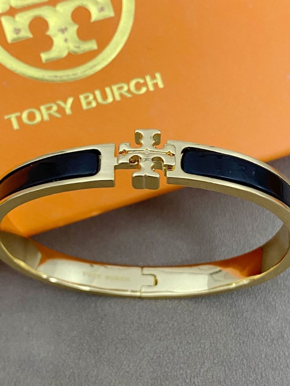 Tory Burch GoldโTone Black Enamel Logo Hinged Bangle Bracelet